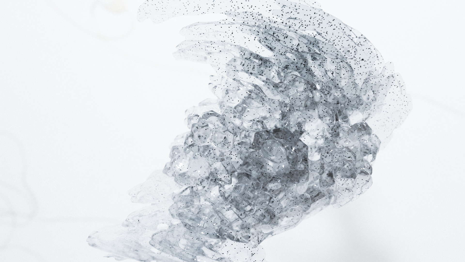 Computer-generated image of an abstract glass sculpture with black dots in a sterile white void.
